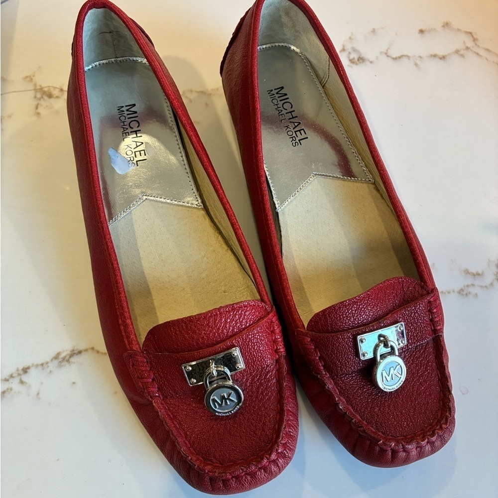 Michael Kors red leather loafers with silver buckle detail